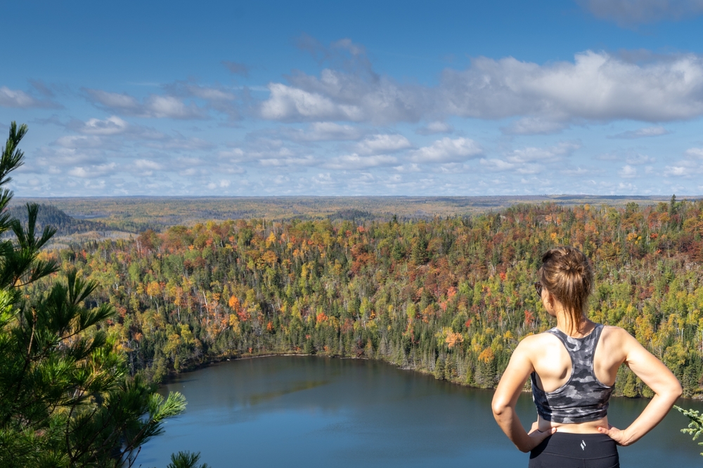 Woman hiking in Minnesota and feeling healthy